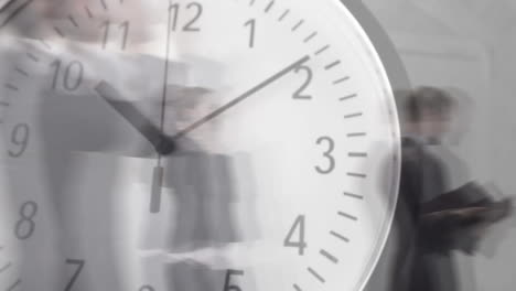 people walking fast with clock in the foreground