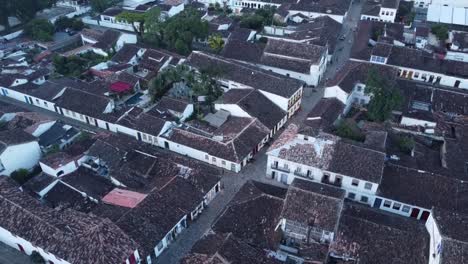 aerial high angle circling over historic city of paraty at sunset, brazil