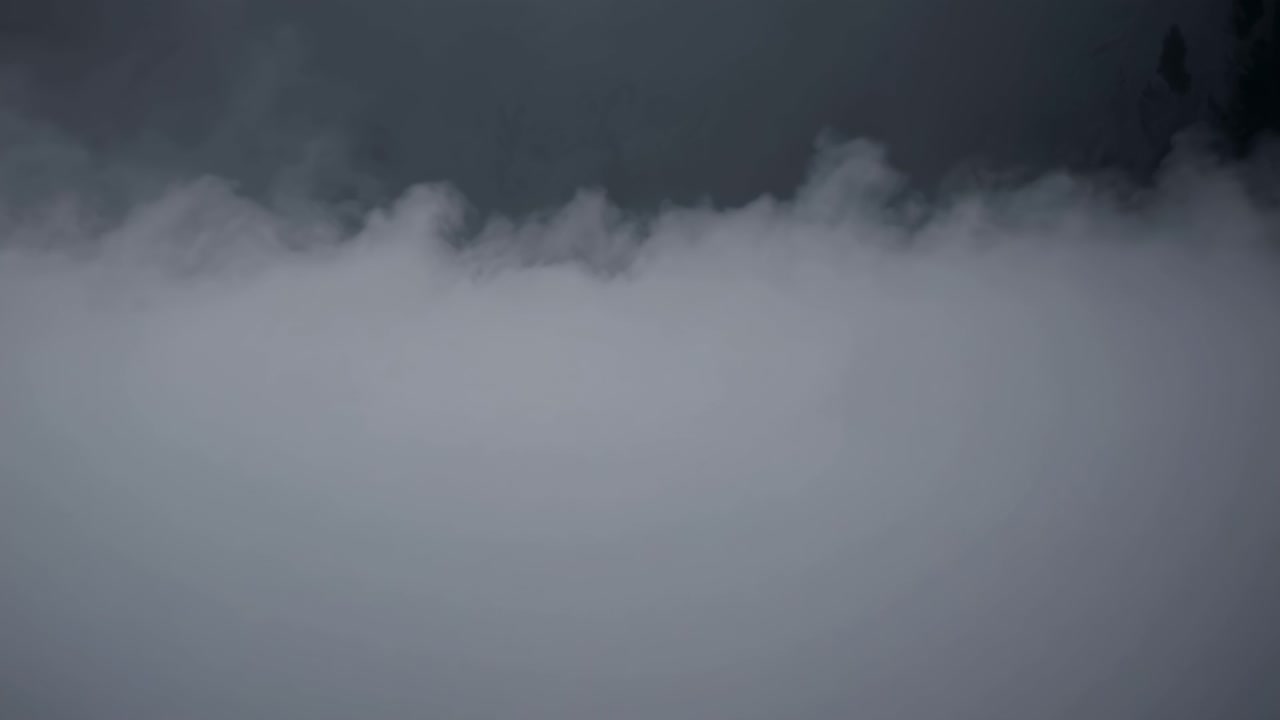 Dense fog enveloping the landscape creates a mysterious and ethereal atmosphere, evoking feelings of tranquility and wonder as the world transforms into a serene, hazy dreamscape