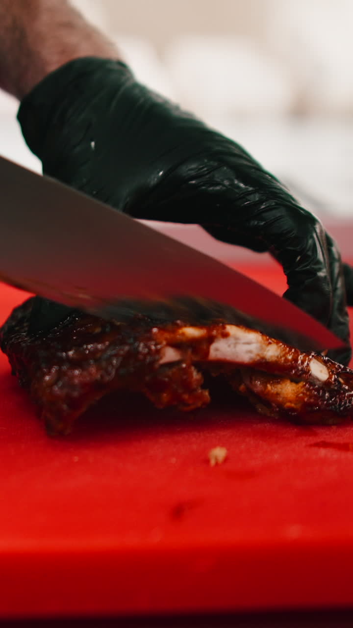 Cutting ribs on a red surface