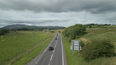 Busy-rural-road-A66-into-mountains-with-mountain-Blencathra-on-horizon