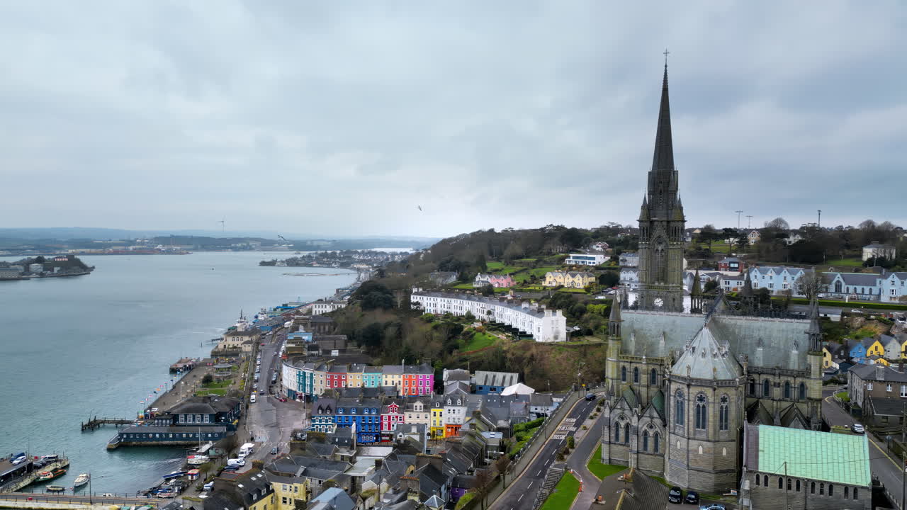 Aerial drone view of the colourful houses surrounding the St Colman's Cathedral in Cork, Ireland