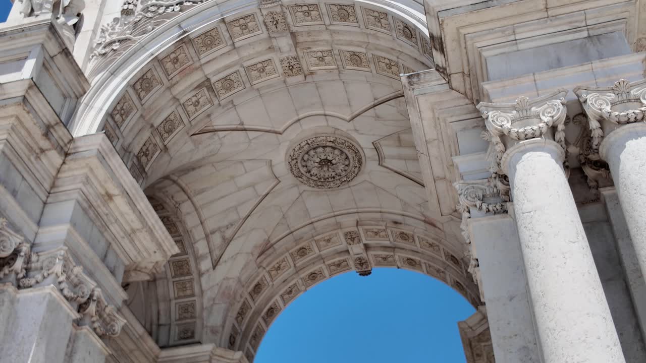 View of the iconic Rua Augusta Arch showing sculptures and detailed carvings