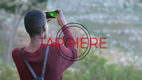 taking photo with phone, person capturing animation with tap here overlay