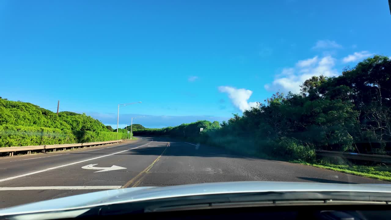 View Of Cars Driving in Kauai Hawaii for amazing view of Napali coast in Kauai. Kalalau valley Lookout, Kauai, Hawaii. superb view into the heart of the Kalalau Valley one of the most photographed