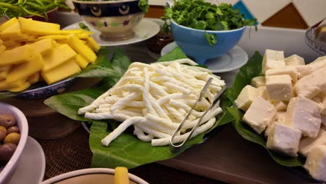 selection of cheeses at a buffet
