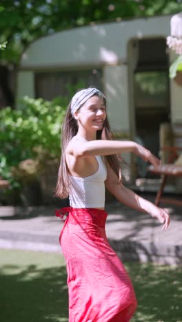 woman in a red skirt by a camper van