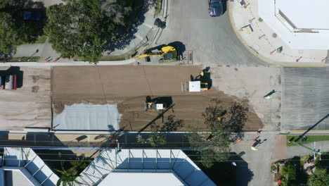 Aerial-Drone-Top-Down-View-Of-Roadworks-With-Workers-And-Roller,-4K