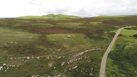 Aerial-view-flying-above-Great-Orme-Llandudno-mountain-valley-highlands-rural-landscape