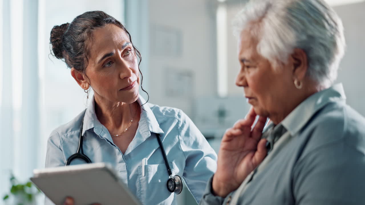 Doctor consulting a senior patient in an office