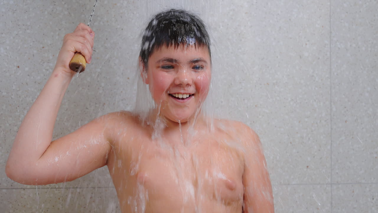 A Boy Having Fun in the Shower