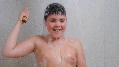 a boy having fun in the shower