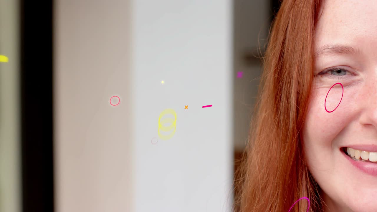 Woman smiling, triggered by rings and shapes appearing left and passing near cheek for marketing