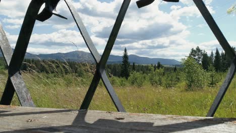 mountain view through a fence