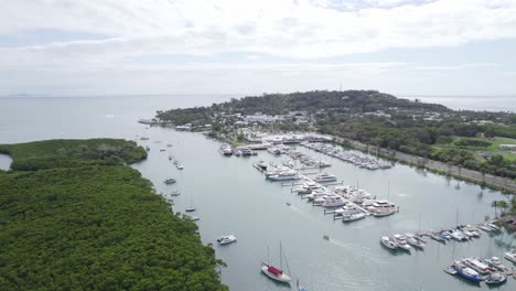 Boats-And-Yachts-Docked-At-The-Marina-On-The-Packers-Creek-In-Port-Douglas,-Queensland,-Australia