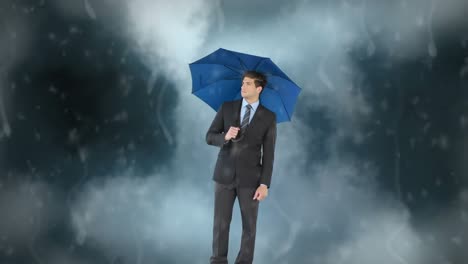 zakenman met zijn paraplu onder de storm