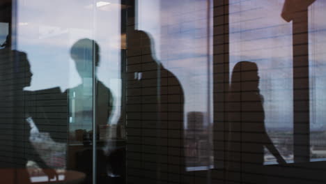 4k footage of businesspeople walking in a modern