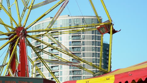 Ferris-Wheel-Amusement-Ride-buckets-spinning-at-the-Fun-Fair