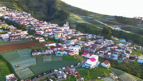 Aerial-view-of-beautiful-Indonesian-village-on-the-slope-of-mountain-called-Nepal-Van-Java-in-the-morning