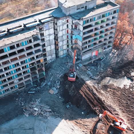 special machinery destroys old buildings. destruction of a building with special machine