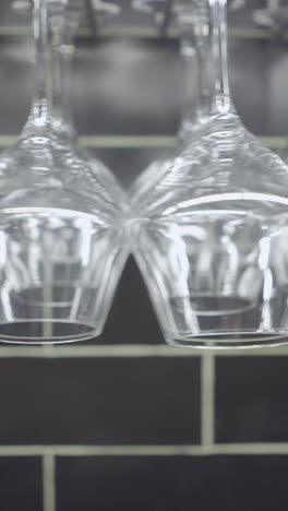 wine glasses hanging in a rack