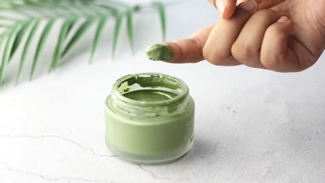 bubble clay mask in container on white background