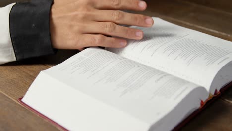 blind woman reading a braille book