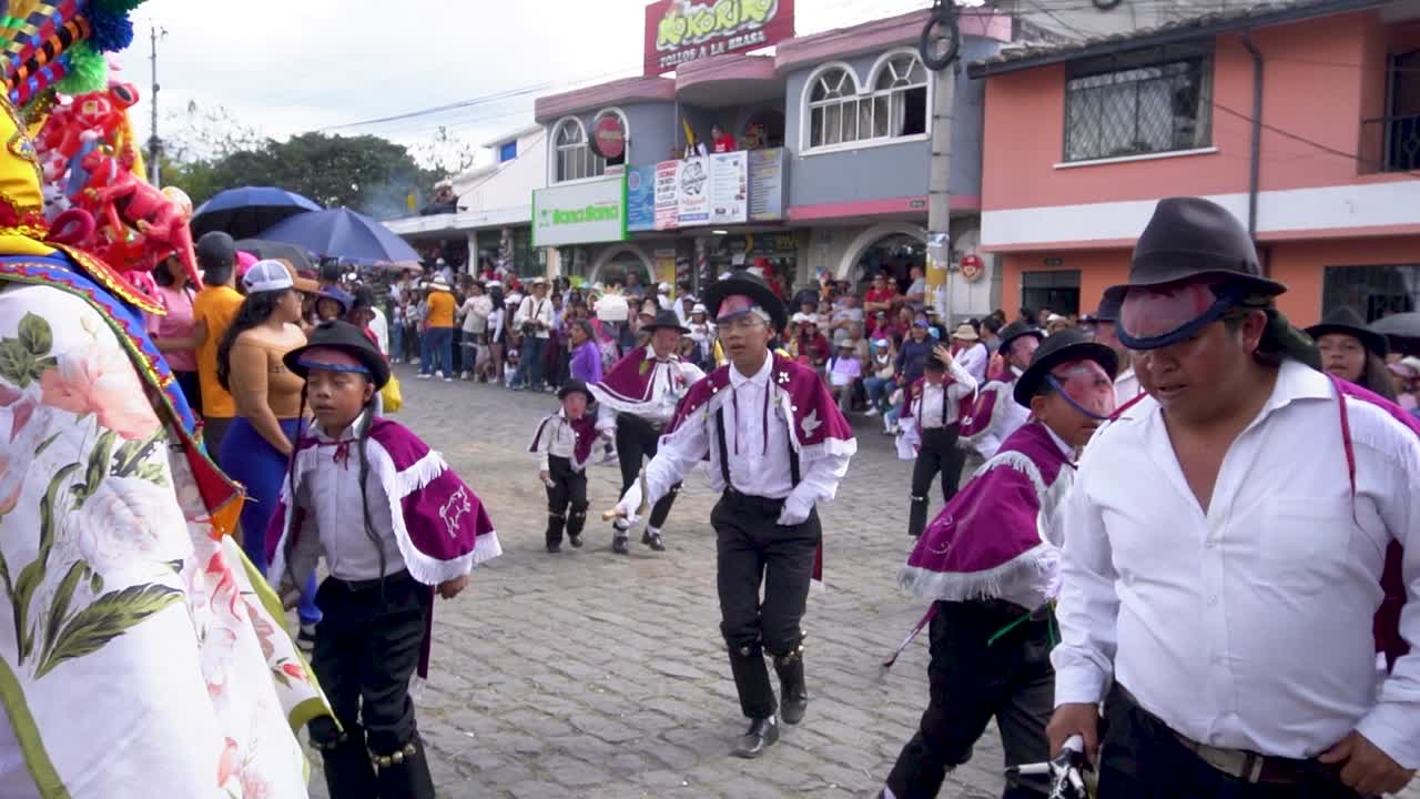 Folk dancers dancing on streets of Huancayo in Peru at Andean Festival. Slow motion shot.