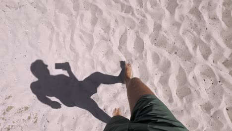 Man-walking-on-clean-blue-flag-beach-in-Halkidiki-Peninsula,-Greece