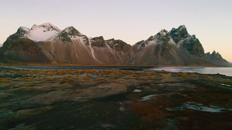 vestrahorn mountain aerial view over low tide stokksnes beach at sunrise
