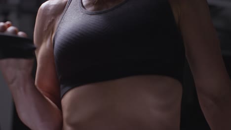 Close-Up-Studio-Shot-Of-Mature-Woman-Wearing-Gym-Fitness-Clothing-Exercising-With-Resistance-Band-2