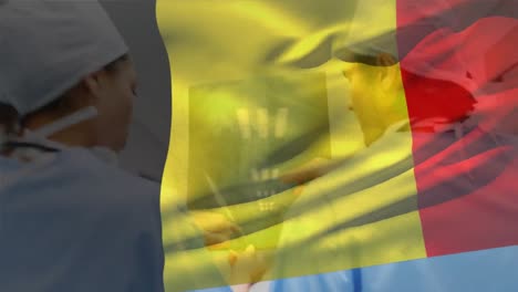 animation of belgium flag, diverse surgeons discussing x-ray reports while walking in corridor