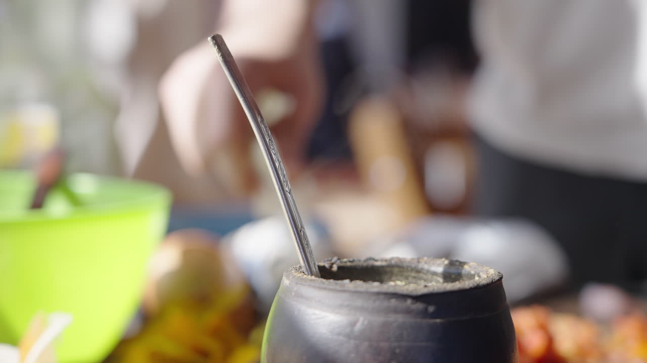 Close-up of Steaming Yerba Mate Drink in Traditional Gourd