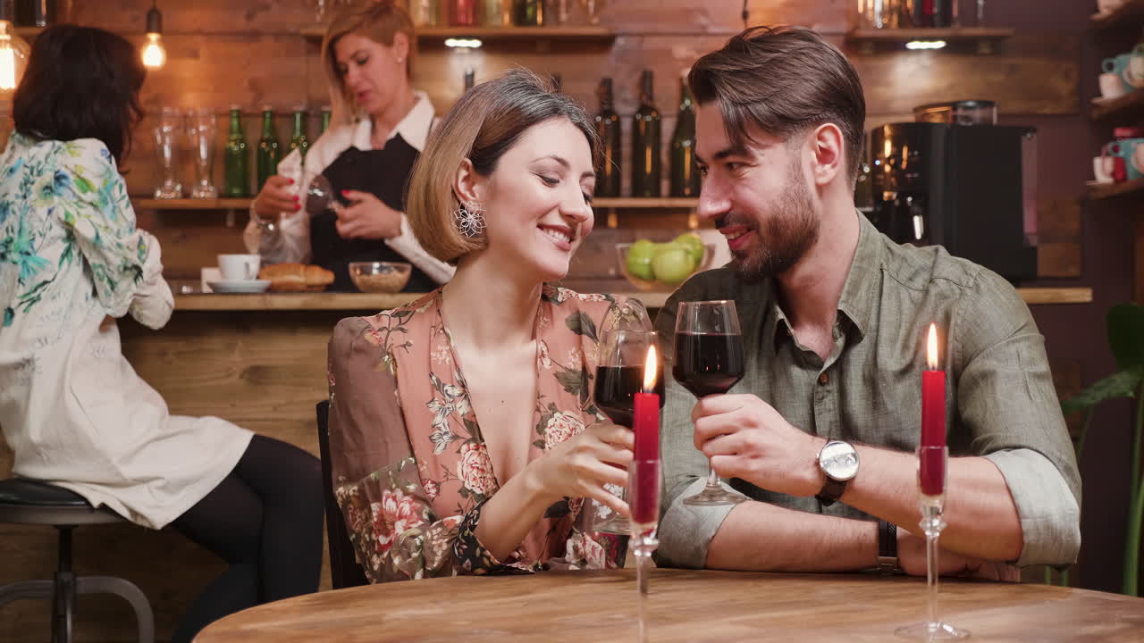 Romantic Couple Enjoying Wine at a Restaurant