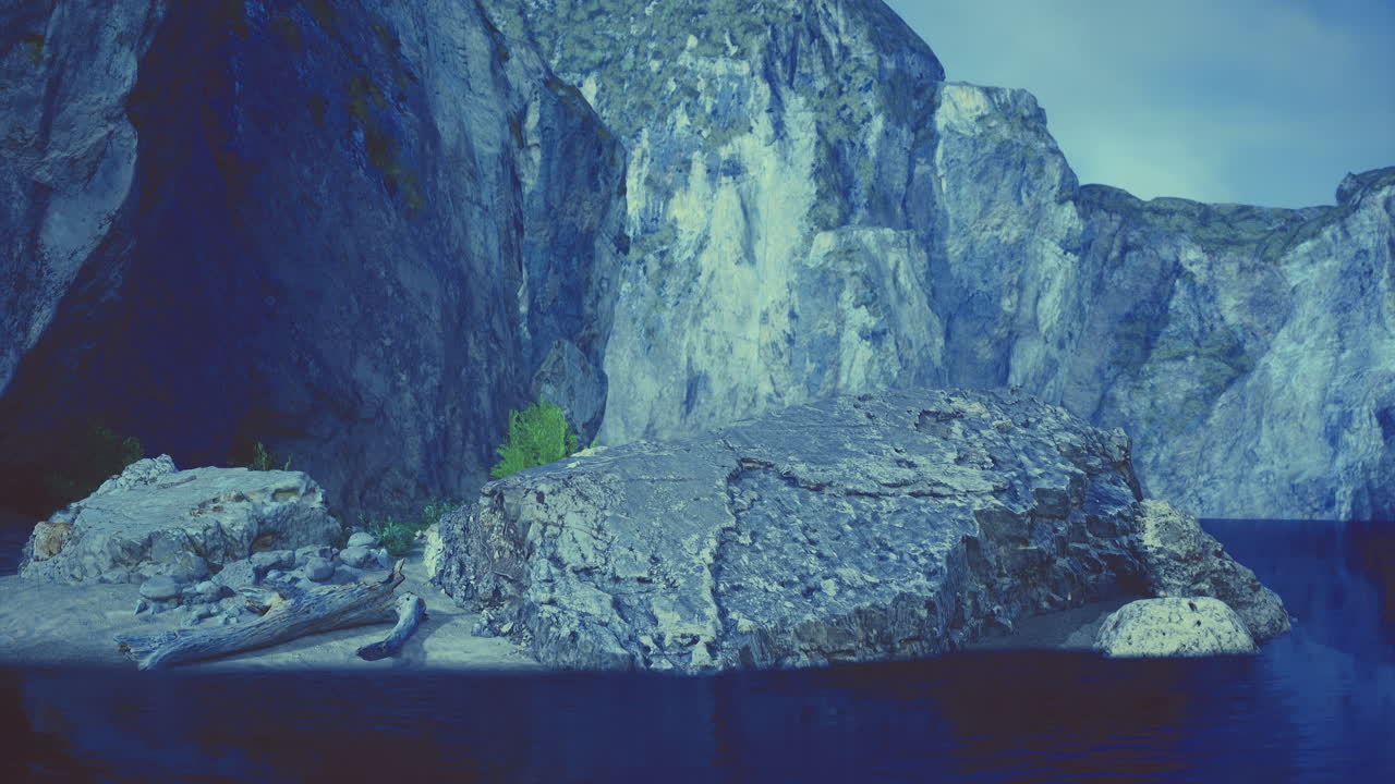 Scenic view of rugged cliffs and calm waters with lush greenery