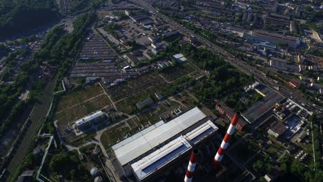 aerial view heating station in city. car traffic on highway junction in city