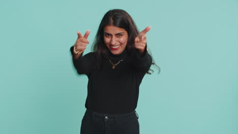 indian woman smiling excitedly, pointing to camera, choosing lucky happy winner, indicating, hey you