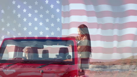 animation of flag of usa over happy diverse women in car by beach in summer