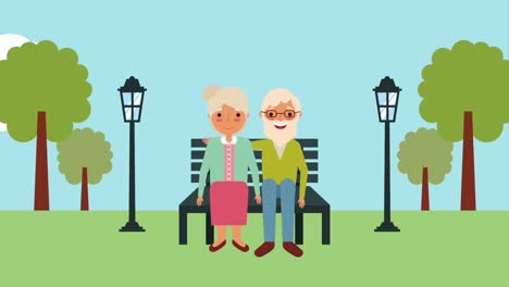 una pareja de ancianos sentada en un banco en el parque