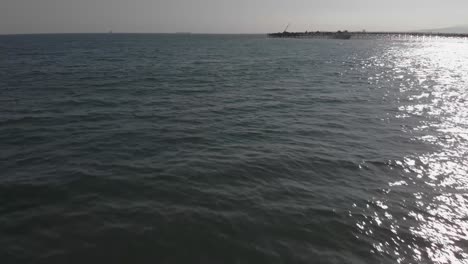 4k shot of a drone approaching the pacific ocean in june 2019