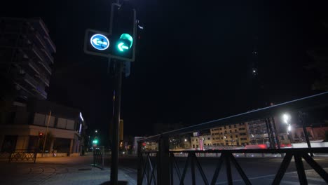 street intersection time lapse with left turn only traffic lights at night