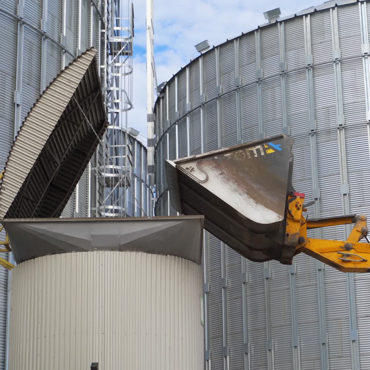 Steel silos for storing grain. Grain elevator at modern agro processing factory