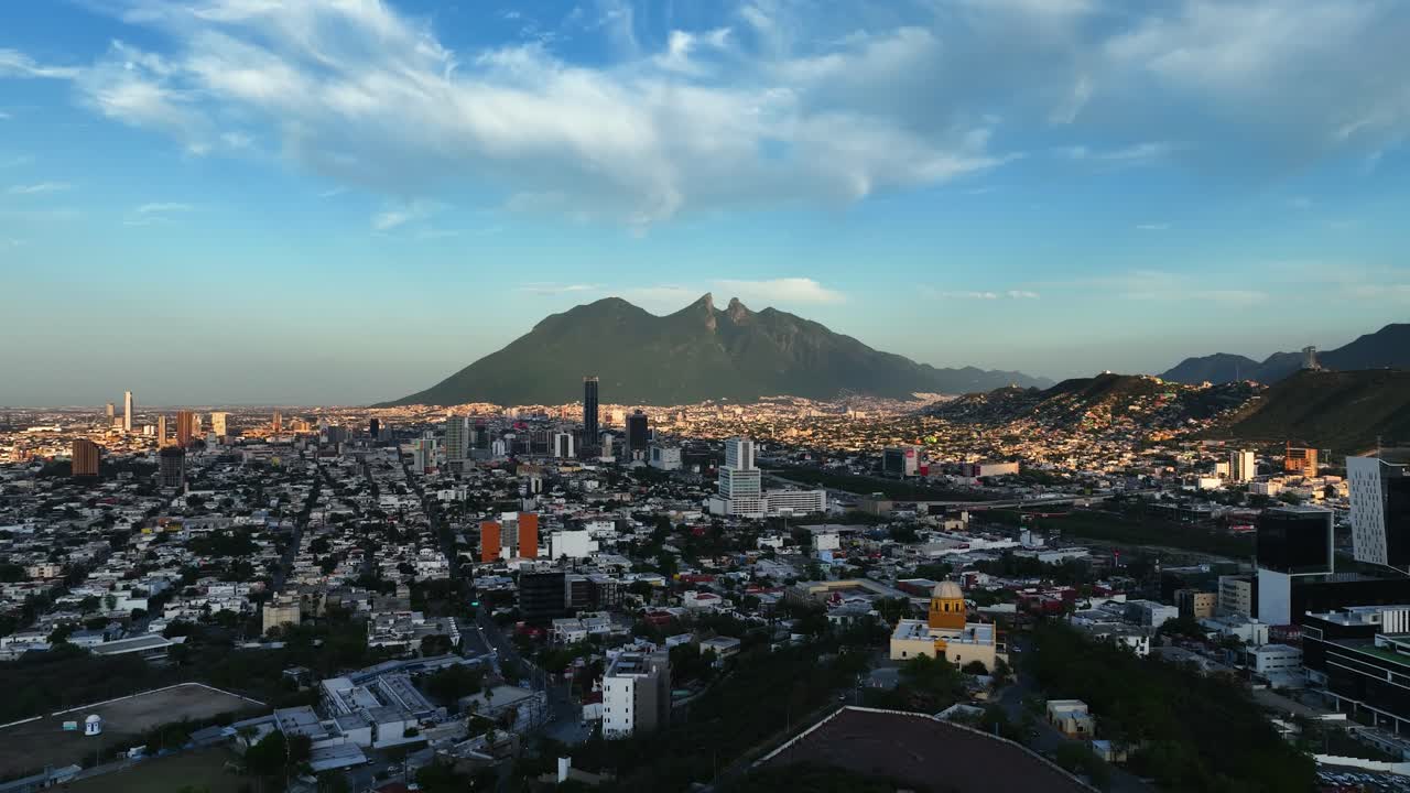 Aerial view rising over the Bishopric Hill, sunny evening in Monterrey, Mexico