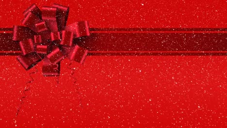 digital animation of red ribbon with gift bow against red background 4k