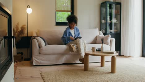 woman relaxing on a sofa in a modern living room