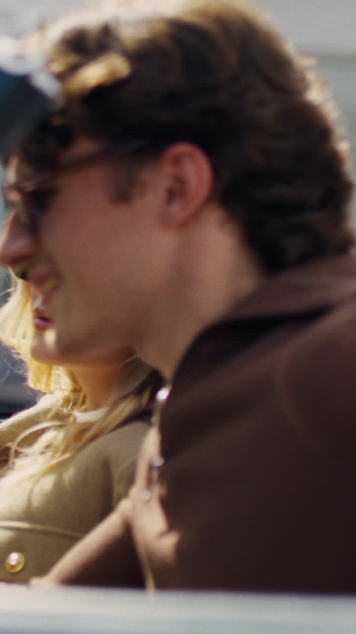 Stylish Couple Enjoying a Moment in a Retro Car