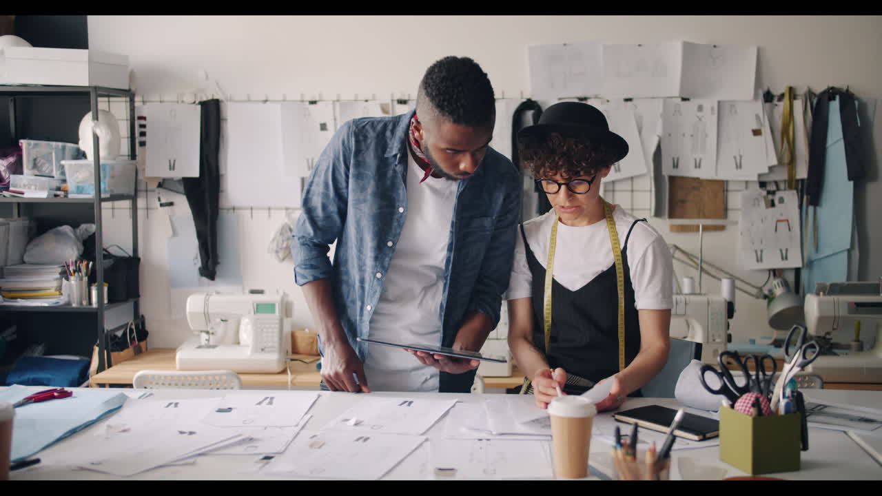 Fashion Designers Collaborating in Studio