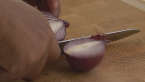 cutting purple onion for peruvian ceviche