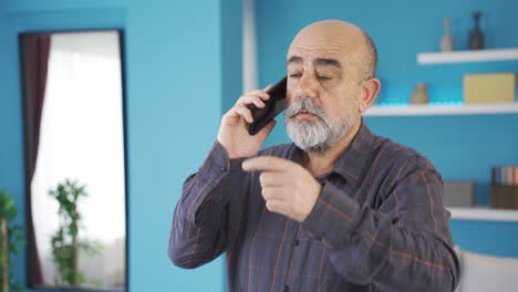 Old-man-talking-on-the-phone-in-an-angry-and-angry-state.