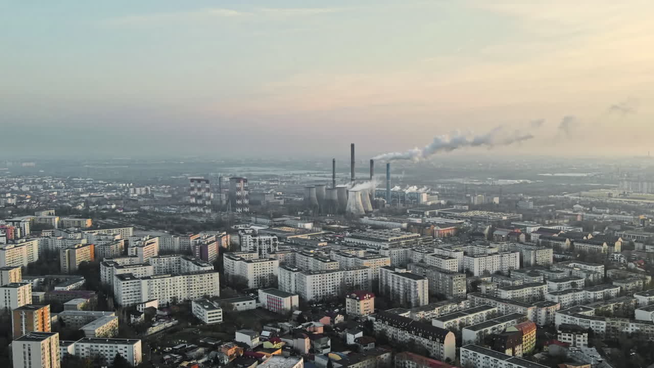 Cityscape of Bucharest from a drone, rows of residential buildings, thermal station with fog getting out and other the ground, ecology idea, Romania